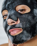 Nuria Defend Purifying Bubble Mask - woman with activated, bubbling mask on face
