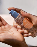 Nuria Defend Essence - product being dispensed into hand