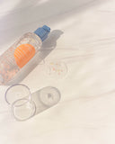 Nuria Defend Essence - bottle on counter with essence dispensed