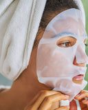 Nuria Hydrate Replenishing Biocellulose Mask - woman with mask applied to face