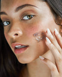 Nuria Hydrate Revitalizing Jelly Night Treatment - woman applying jelly to cheek