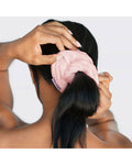 Kitsch pink towel scrunchie, woman wrapping scrunchie around pony tail