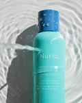Nuria Hydrate Moisturizing Toner - bottle under water with ripples and reflections