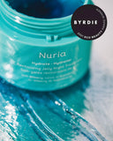 Nuria Hydrate Revitalizing Jelly Night Treatment - open jar on white background showing blue-tinted jelly. Byrdie 2021 Eco Beauty Award Winner
