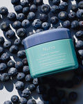 Nuria Hydrate Revitalizing Jelly Night Treatment - jar resting on bilberries