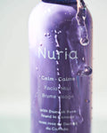 Nuria Calm Facial Mist - bottle with water running down the sides