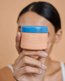 Defend Overnight Recovery Cream - woman showing jar held between finger and thumb